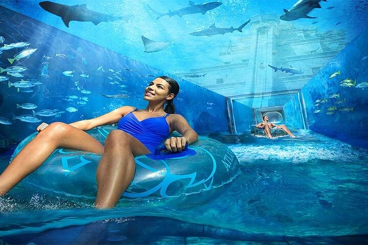 Experience the excitement of sliding through crystal-clear waters surrounded by incredible marine life. Atlantis Aquaventure Waterpark offers endless fun for everyone making every moment unforgettable.
